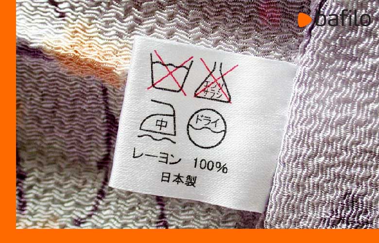دلیل استفاده از نماد مثلث در برچسب لباس چیست؟